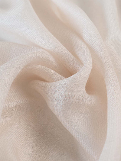 A close-up of the ivory Featherlight Cashmere Scarf.