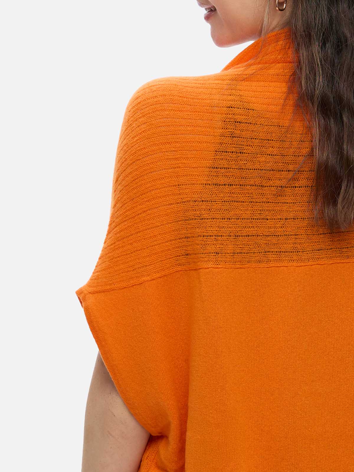 Orange cashmere vest with textured back design on a white background