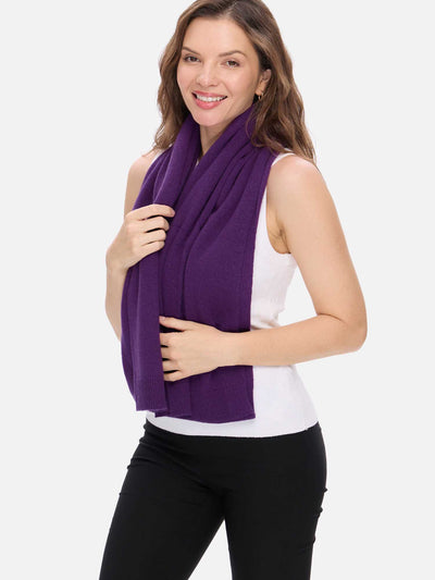 Woman wearing a purple scarf on a white background
