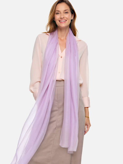 Woman wearing a light purple scarf on a white background