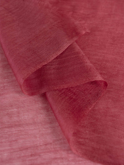 Close-up of red fabric with a textured surface