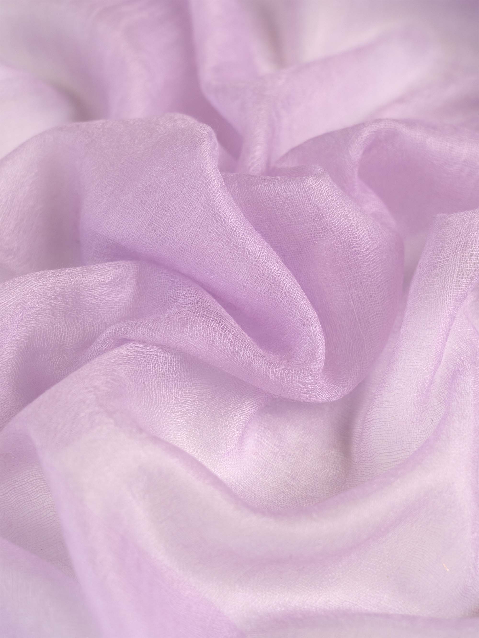 Close-up of soft, light purple fabric with a subtle texture.