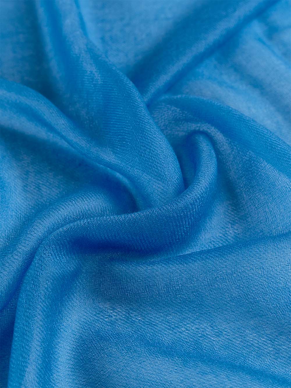 A close-up of the Blue Featherlight Cashmere Scarf.